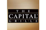 A capital grille logo on a brown background